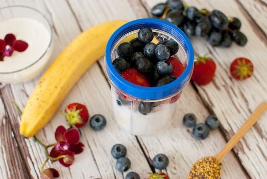 healthy organic fruit and nuts smoothie on wooden board