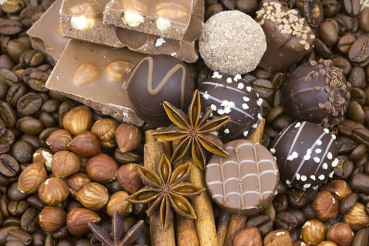 background with chocolate, coffee, spices and nuts