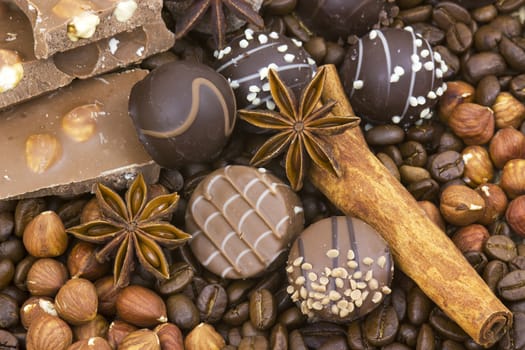 background with chocolate, coffee, spices and nuts