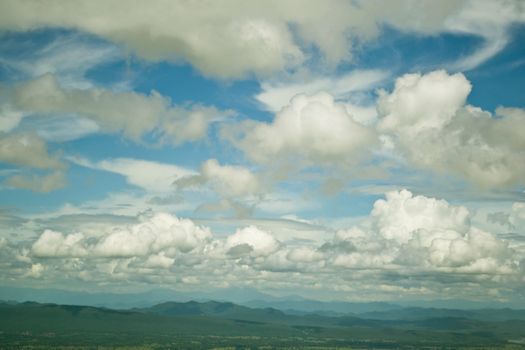 Mountains green grass and blue sky landscape 