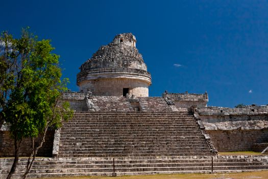 An ancient Mayan astronomical observatory located in the chichen itza arcaeological site, Mexico