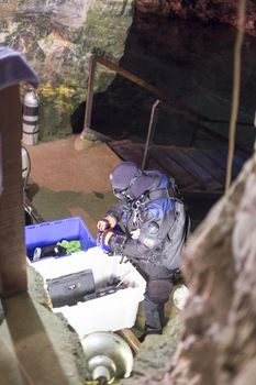 OURO PRETO, BRAZIL - JULY 27: Man prepares to dive into the Passage Mines lake. The mines connect two cities, and the underground lake reaches 240 meters at its deepest. July 27, 2014 in Ouro Preto.