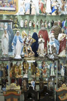 BELO HORIZONTE, BRAZIL - JULY 28: Religious icons wrapped in plastic in Brazilian market. The saints are significant to Catholicism and African-Brazilian religions. July 28, 2014 in Belo Horizonte.