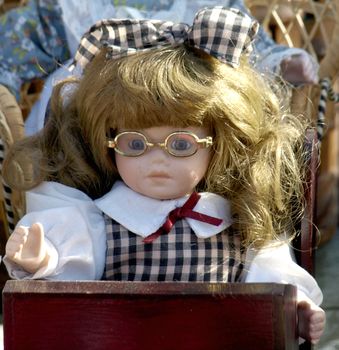 Old doll for sale at antiques fair    