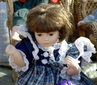 Old doll for sale at antiques fair         