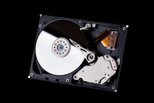 an opened hard disk on black background