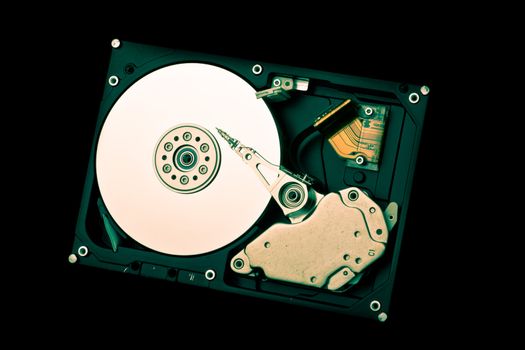 an opened hard disk on black background