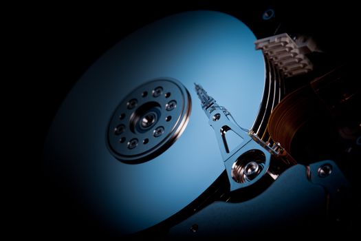 an opened hard disk on black background