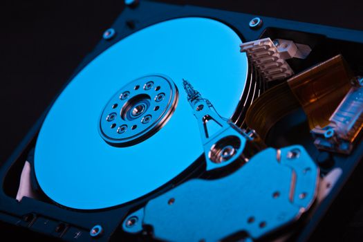 an opened hard disk on black background