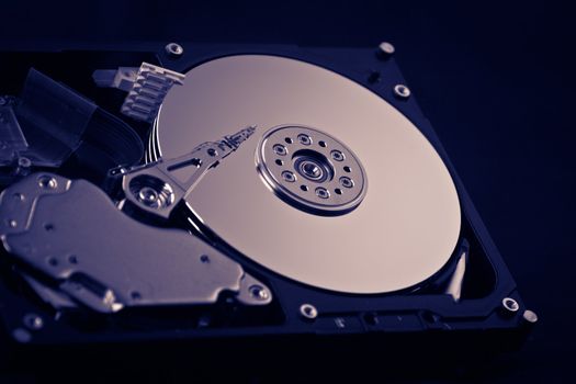 an opened hard disk on black background