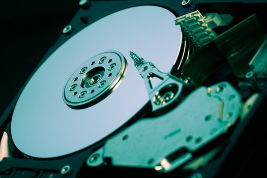 an opened hard disk on black background