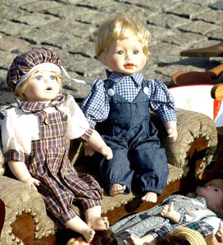 Old dolls for sale at antiques fair   