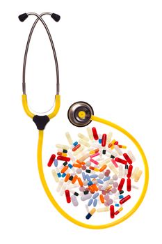 many pills and capsules over white surrounded by a yellow stethoscope