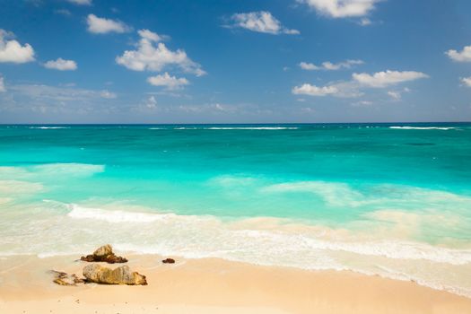 Tropical beach with some rocks