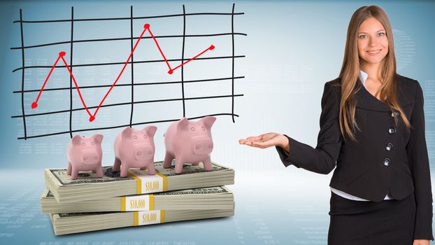 Businesswoman points hand on piggy banks and money. Schedule of price increases in background