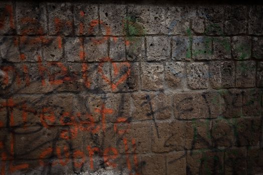 Graffiti on an old, weathered wall