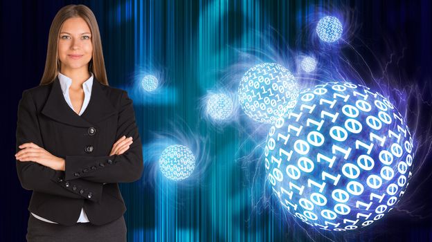 Businesswoman in a suit. Spheres of glowing digits on background