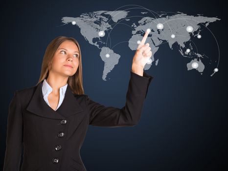 Businesswoman in a suit presses the virtual world map with contacts. The concept of global contacts