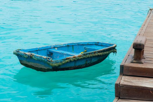 A boat floating on clear sea