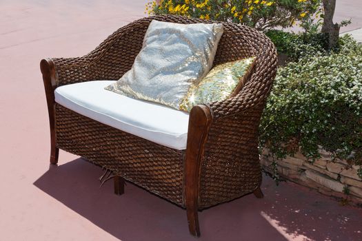 a decorative couch in a garden