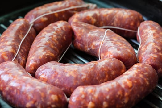 Cooking a succulent and spiced sausage on a grilling pan