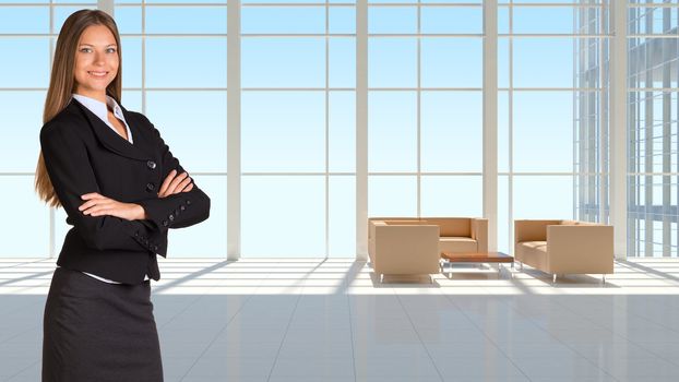 Businesswoman wearing a suit. Large window in office building as background