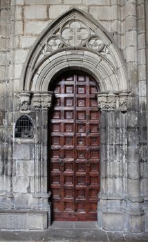The entrance of an old gothic cathedral Frontal view