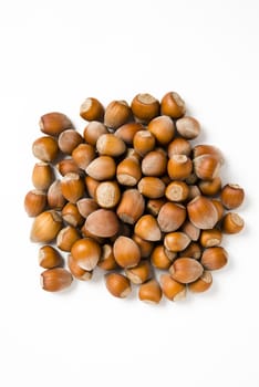 Hazelnuts isolated on white background, macro image