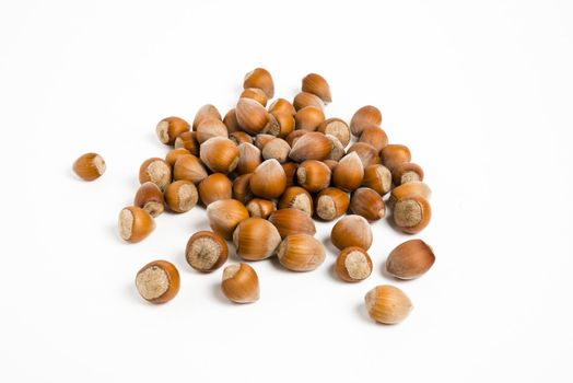 Hazelnuts isolated on white background, macro image
