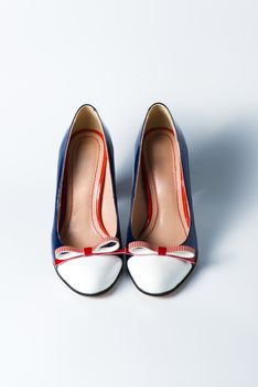 Woman blue shoes on white background