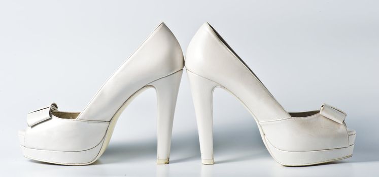 Woman white shoes on white background