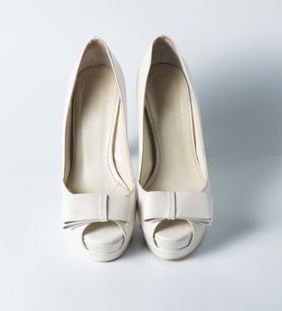 Woman white shoes on white background