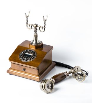 Old wooden phone on white background
