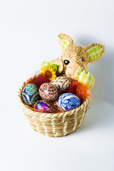 Easter bunny basket with colourfull eggs
