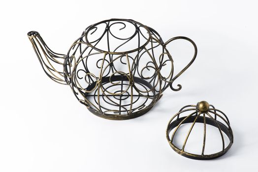 Metal wireframe teapot on white for decoration