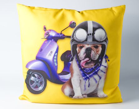 Yellow decorative pillow with dog drawing on it