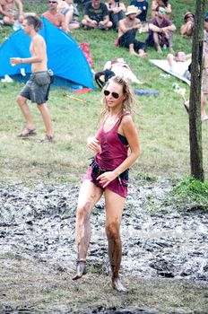 OZORA, HUNGARY - AUGUST 01: Girl dancing in the mud on Ozora Festival, one of the greatest psychedelic music gathering in Euorpe. Ozora, Hungary, Europe August 01, 2014.