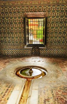 Fountain Mosaic Pavilion Garden Alcazar Royal Palace Seville Andalusia Spain.  Originally a Moorish Fort, oldest Royal Palace still in use in Europe. Built in the 1100s and rebuilt in the 1300s. 