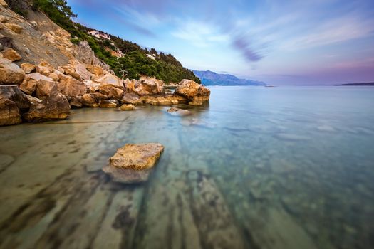 Rocky Beach and Transparent Adriatic Sea near Omis in the Evening, Dalmatia, Croatia