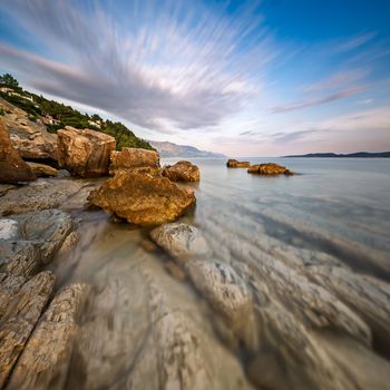 Rocky Beach and Transparent Adriatic Sea near Omis in the Evening, Dalmatia, Croatia