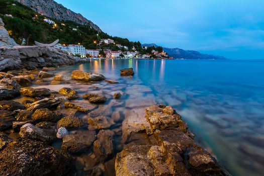 Rocky Beach and Small Village near Omis in the Evening, Dalmatia, Croatia