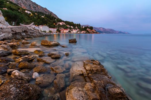 Rocky Beach and Small Village near Omis in the Evening, Dalmatia, Croatia
