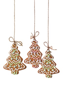 Christmas tree cookies hanging on a natural linen ribbon
