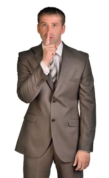Business man with finger on lips asking for silence over white background