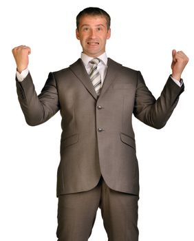 Joyful businessman raised his hands up. Isolated on white