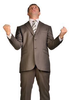 Joyful businessman raised his hands up. Isolated on white