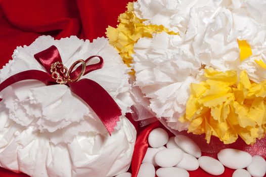  wedding rings on  a colorful fabric background