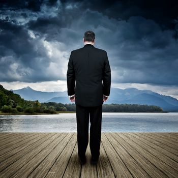 An image of a business man in bad weather