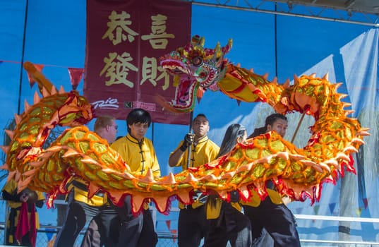 LAS VEGAS - FEB 09 : Dragon dance performers during the Chinese New Year celebrations held in Las Vegas , Nevada on February 09 2014