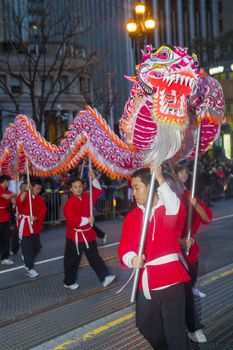 SAN FRANCISCO - FEB 15 : An unidentified participants in a Dragon dance during the Chinese New Year Parade in San Francisco , California on February 15 2014 , It is the largest Asian event in North America 